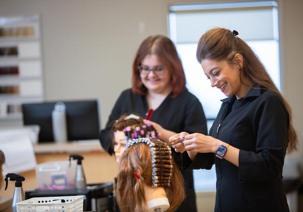 VIU hairdressing student learning on a mannequin